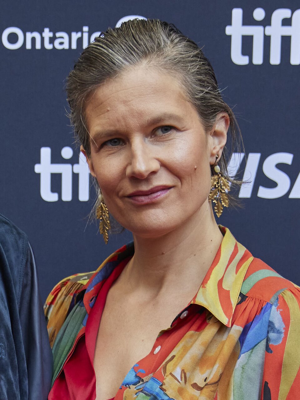 The Duality of Camille: Gentle Warrior and Floral Beauty